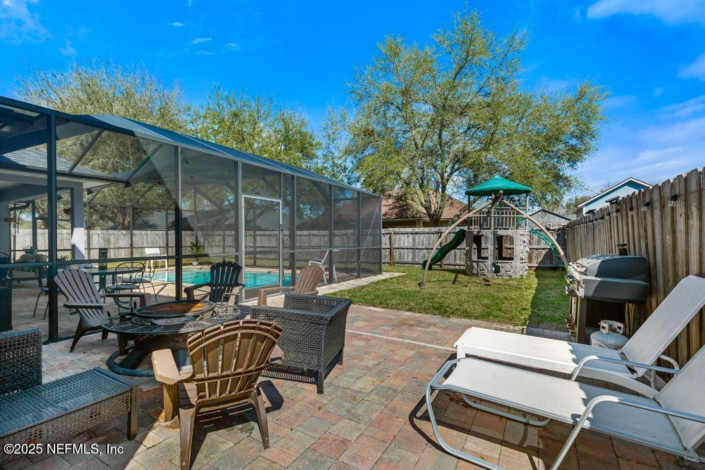 13694 Fish Eagle Drive West Jacksonville, FL 32226 - Photo 49 of 62 a view of a backyard with furniture and a garden