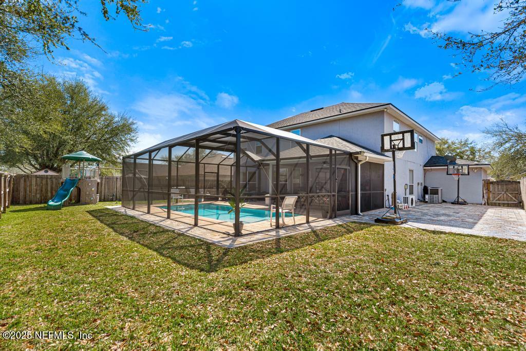 13694 Fish Eagle Drive West Jacksonville, FL 32226 - Photo 50 of 62 a backyard of a house with table and chairs