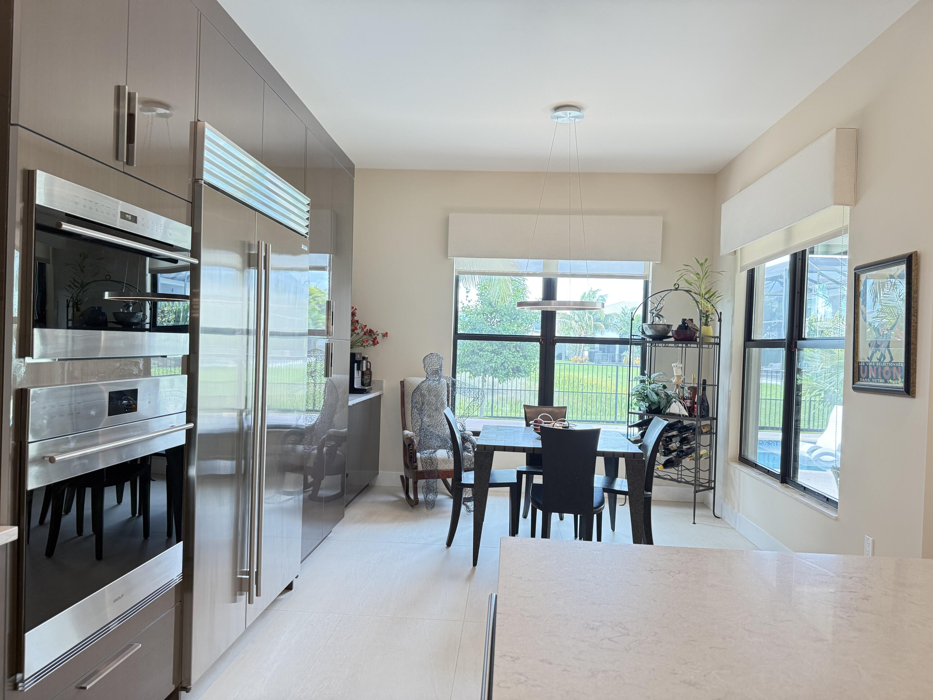 8575 Dearborn River Way Boca Raton, FL 33496 - Photo 14 of 32 a view of a dining room with furniture window and outside view