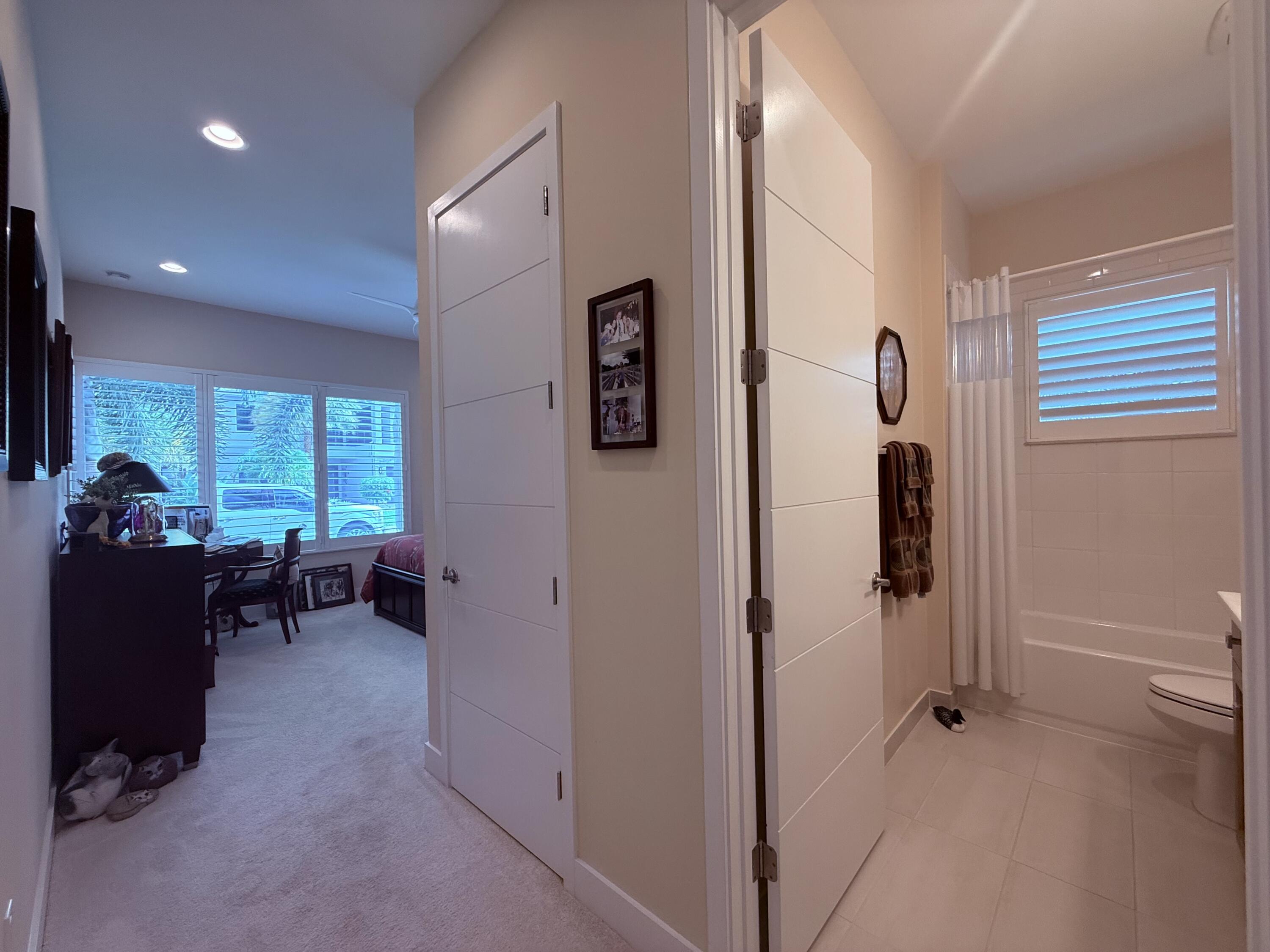 8575 Dearborn River Way Boca Raton, FL 33496 - Photo 17 of 32 a view of hallway with furniture and a window