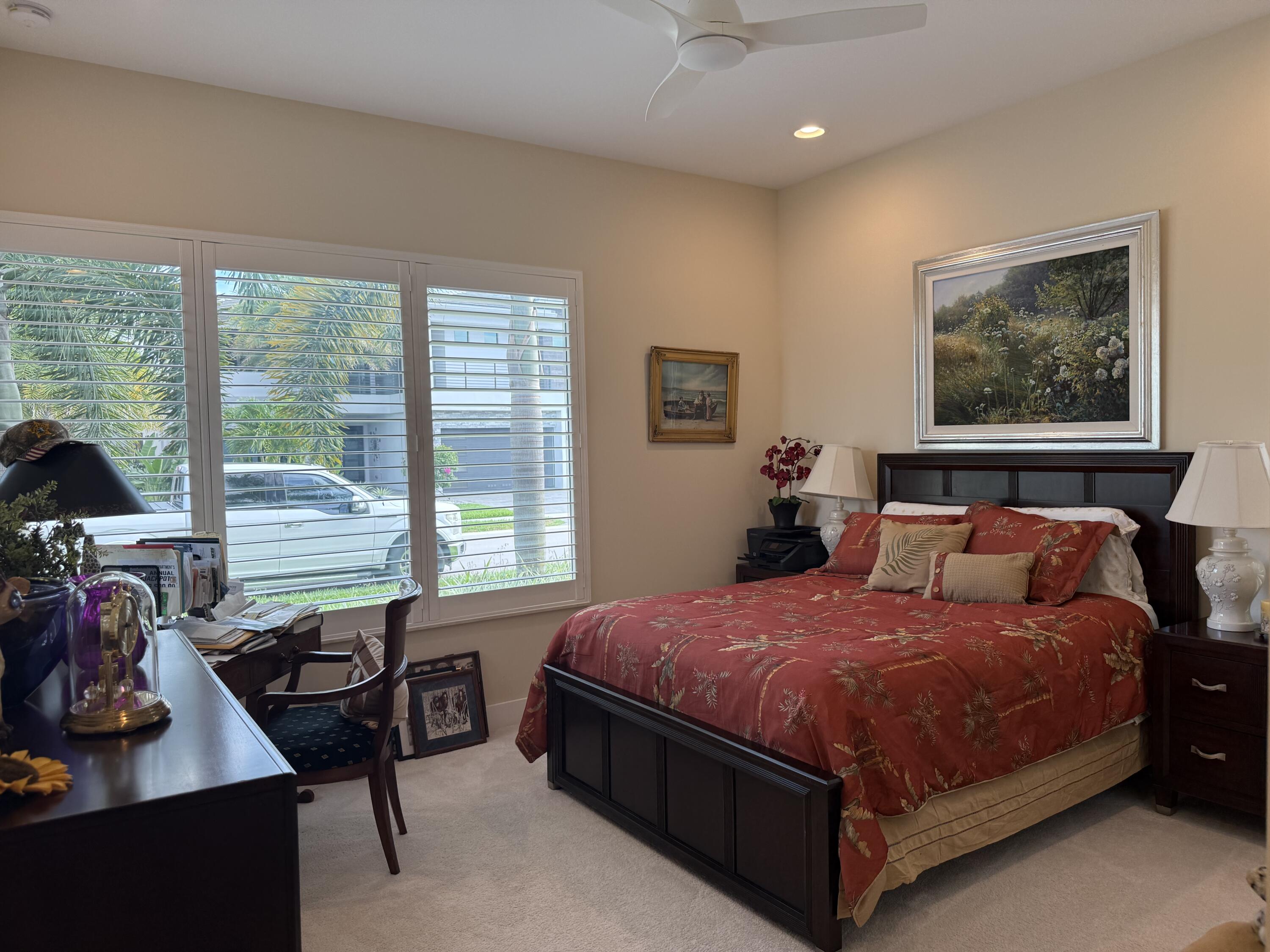 8575 Dearborn River Way Boca Raton, FL 33496 - Photo 20 of 32 a bedroom with a bed window and table