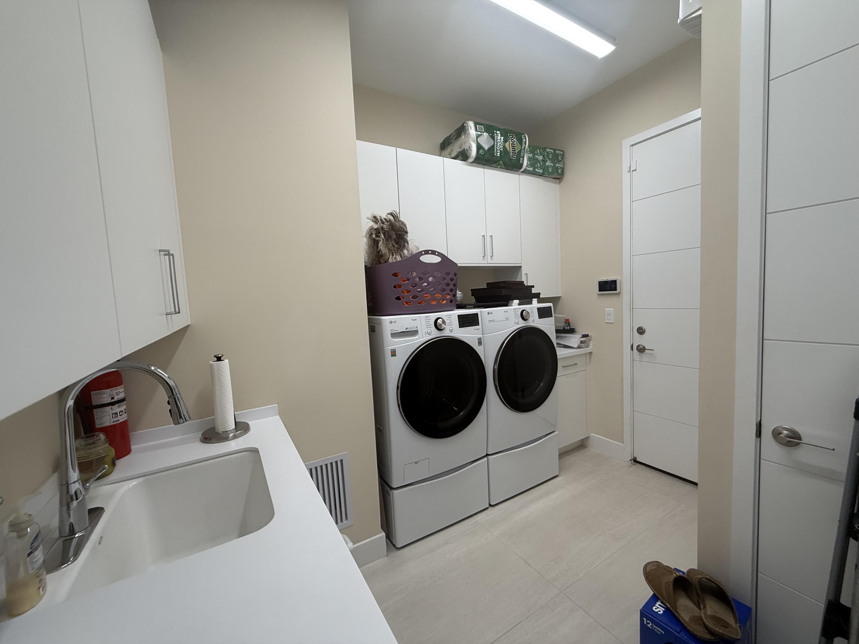 8575 Dearborn River Way Boca Raton, FL 33496 - Photo 29 of 32 a utility room with dryer and washer