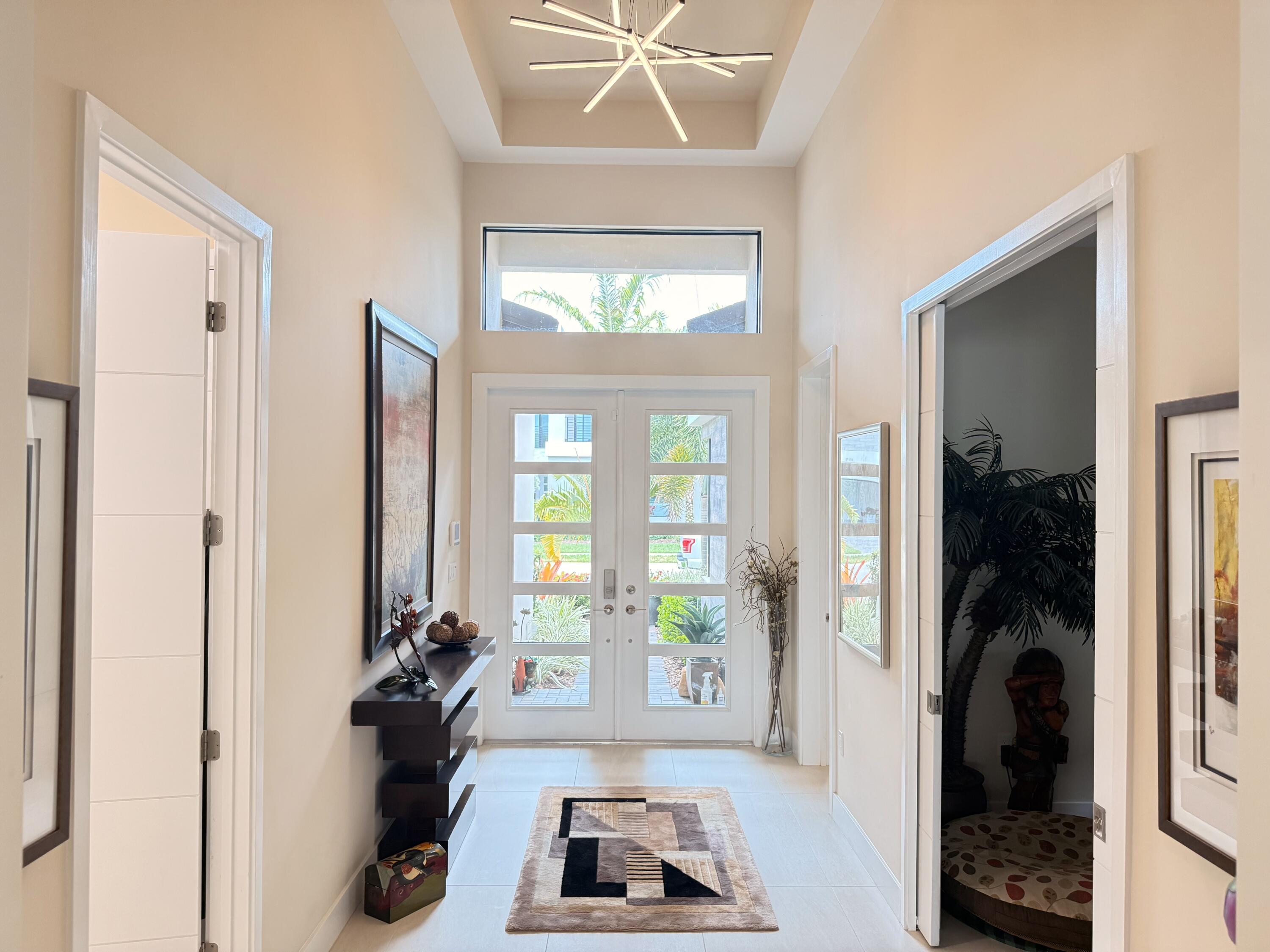 8575 Dearborn River Way Boca Raton, FL 33496 - Photo 3 of 32 a living room with furniture and a large window
