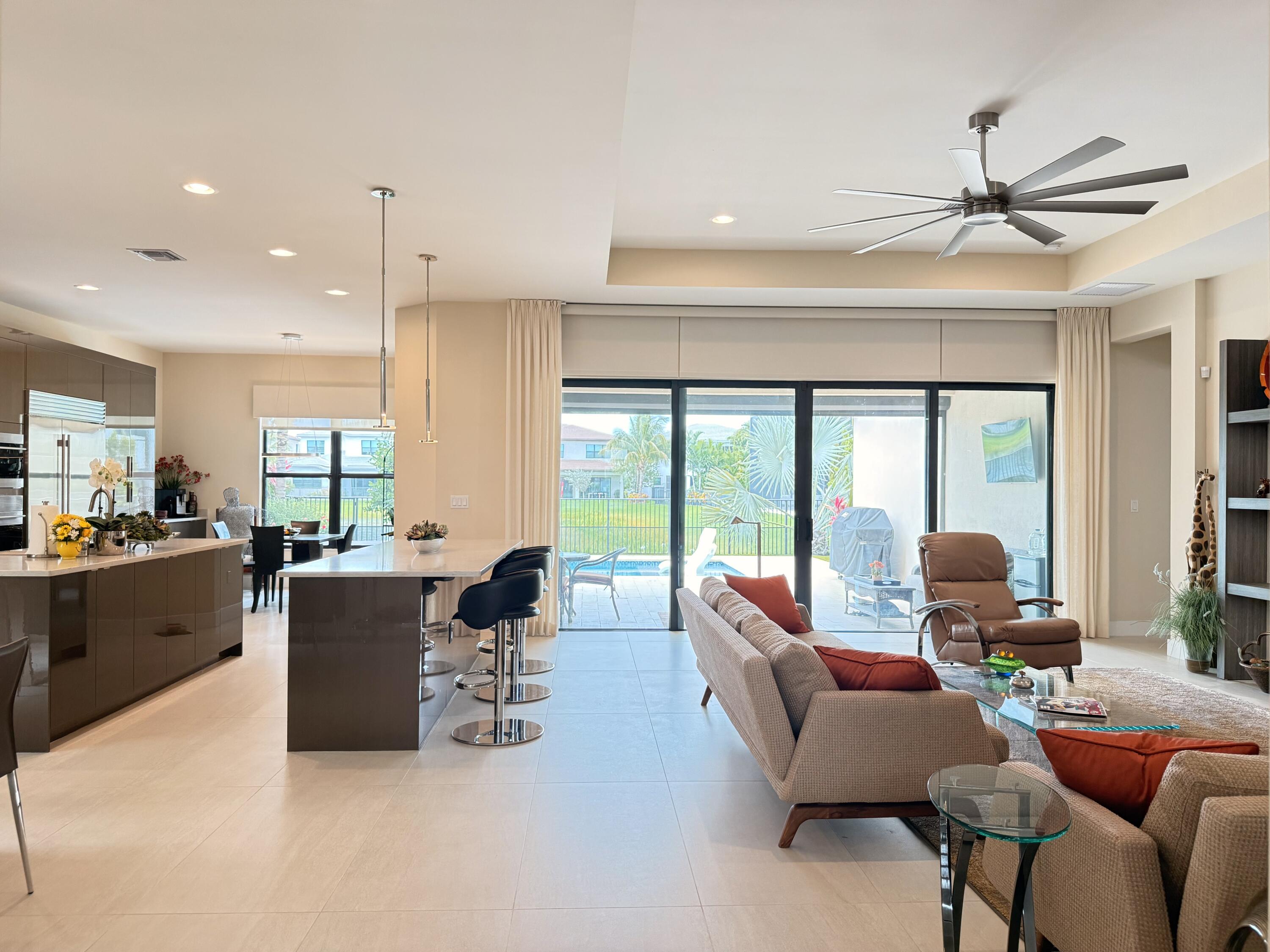8575 Dearborn River Way Boca Raton, FL 33496 - Photo 4 of 32 a living room with furniture and a large window