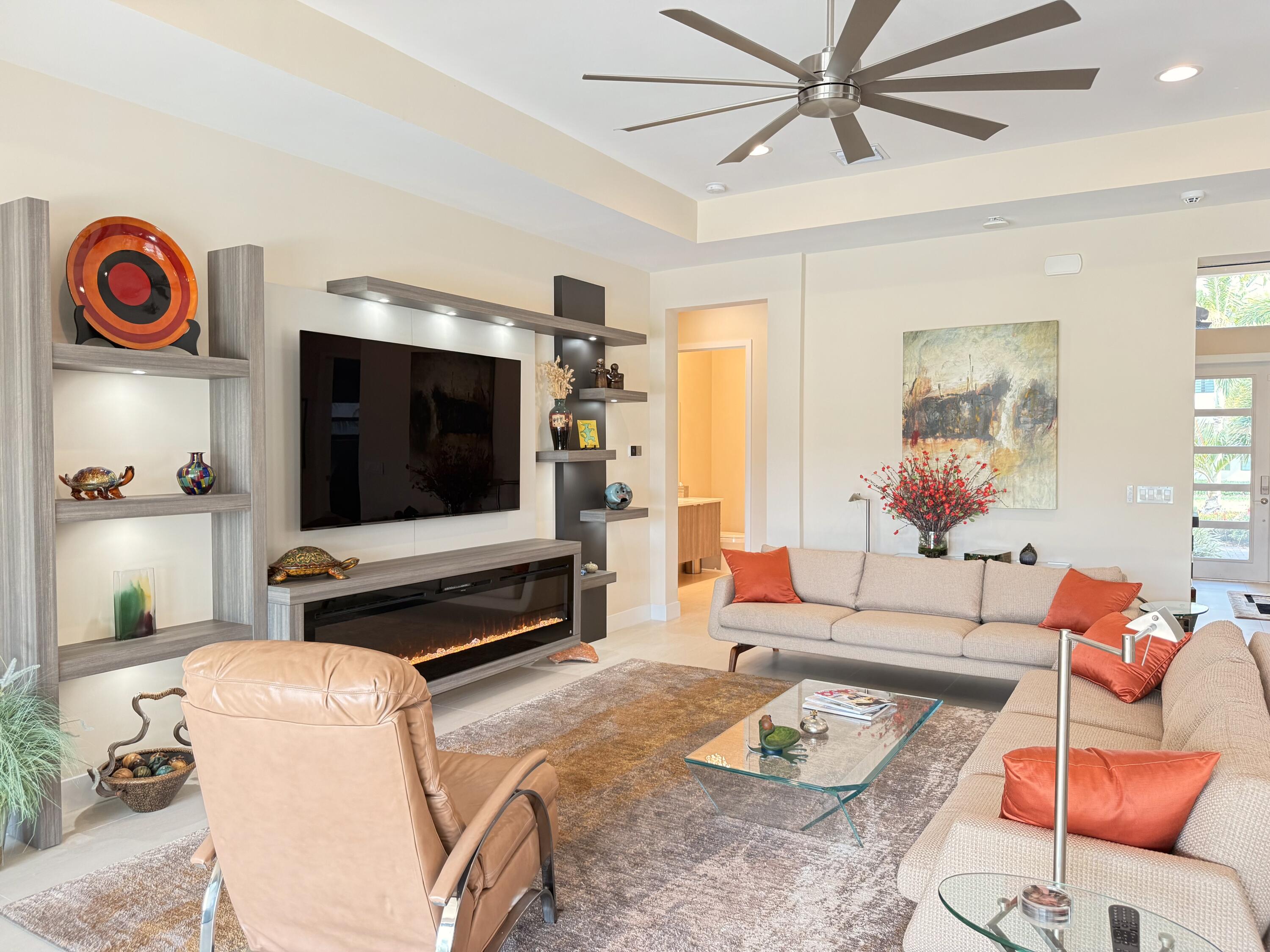 8575 Dearborn River Way Boca Raton, FL 33496 - Photo 5 of 32 a living room with furniture and a flat screen tv