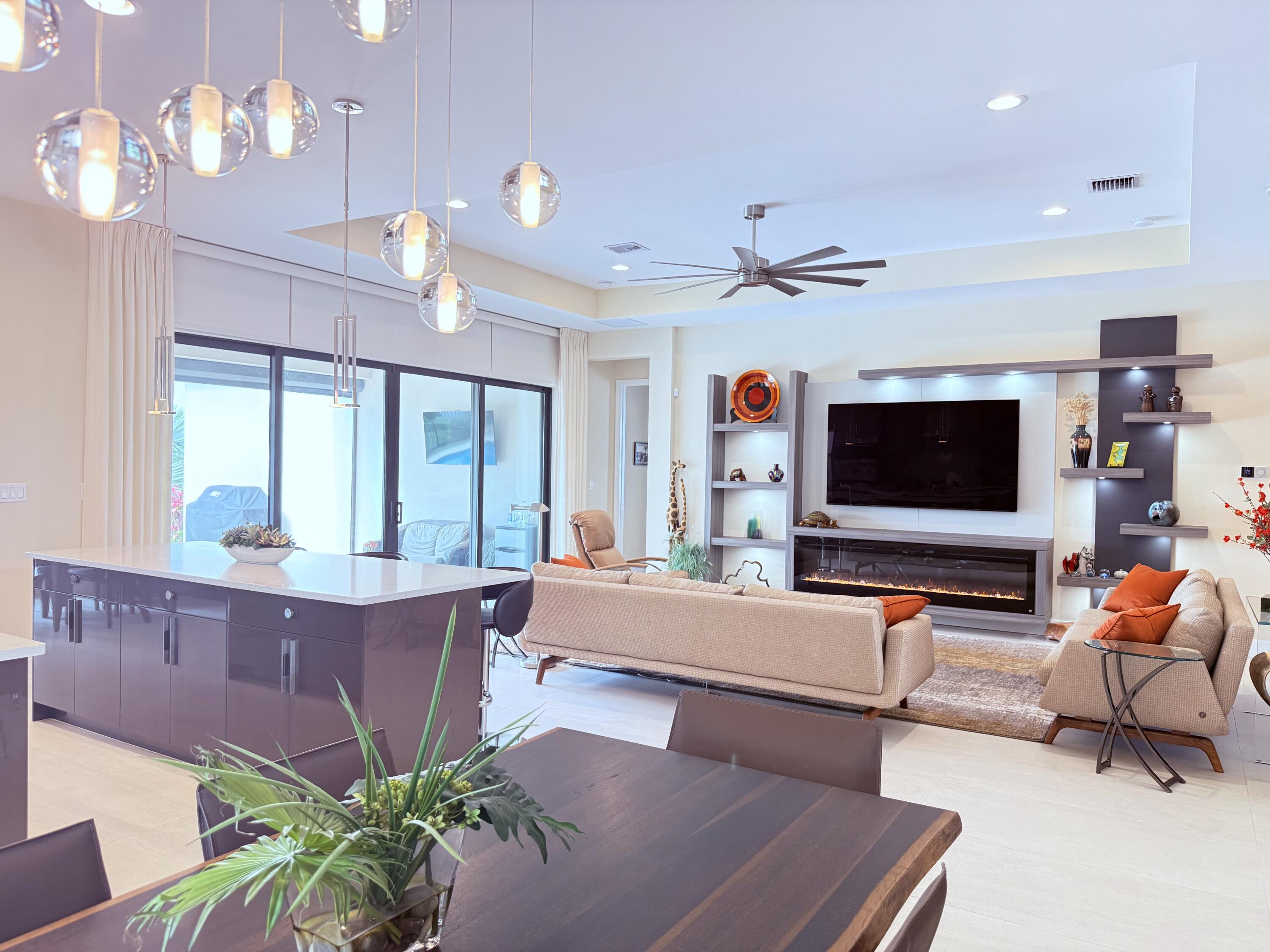 8575 Dearborn River Way Boca Raton, FL 33496 - Photo 7 of 32 a living room with furniture and a flat screen tv