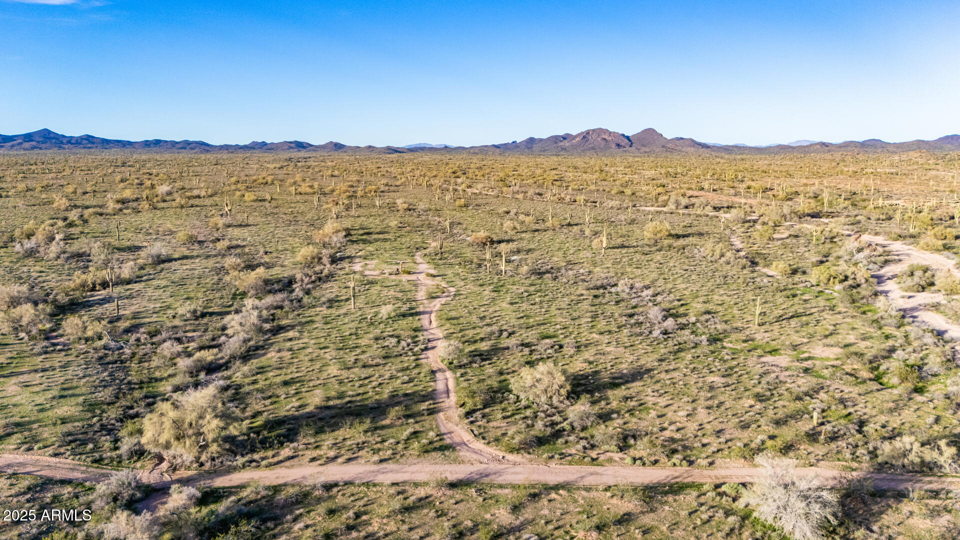 31200 West Tamar Road, Unit 27 Wittmann, AZ 85361 - Photo 3 of 14 a view of a mountain from a yard