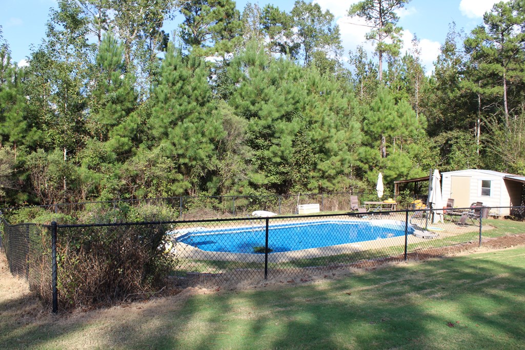 673 Reynolds Road West Fortson, GA 31808 - Photo 3 of 24 a backyard of a house with table and chairs