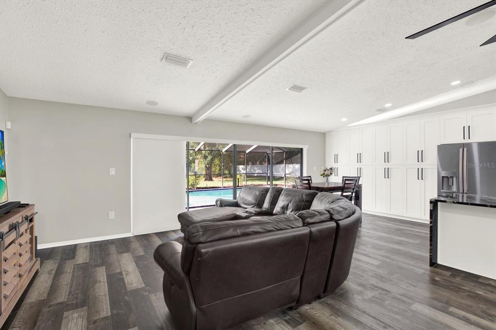 7487 River Country Drive Weeki Wachee, FL 34607 - Photo 21 of 53 a living room with furniture and a large window