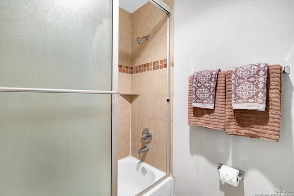 a view of a hallway with stairs