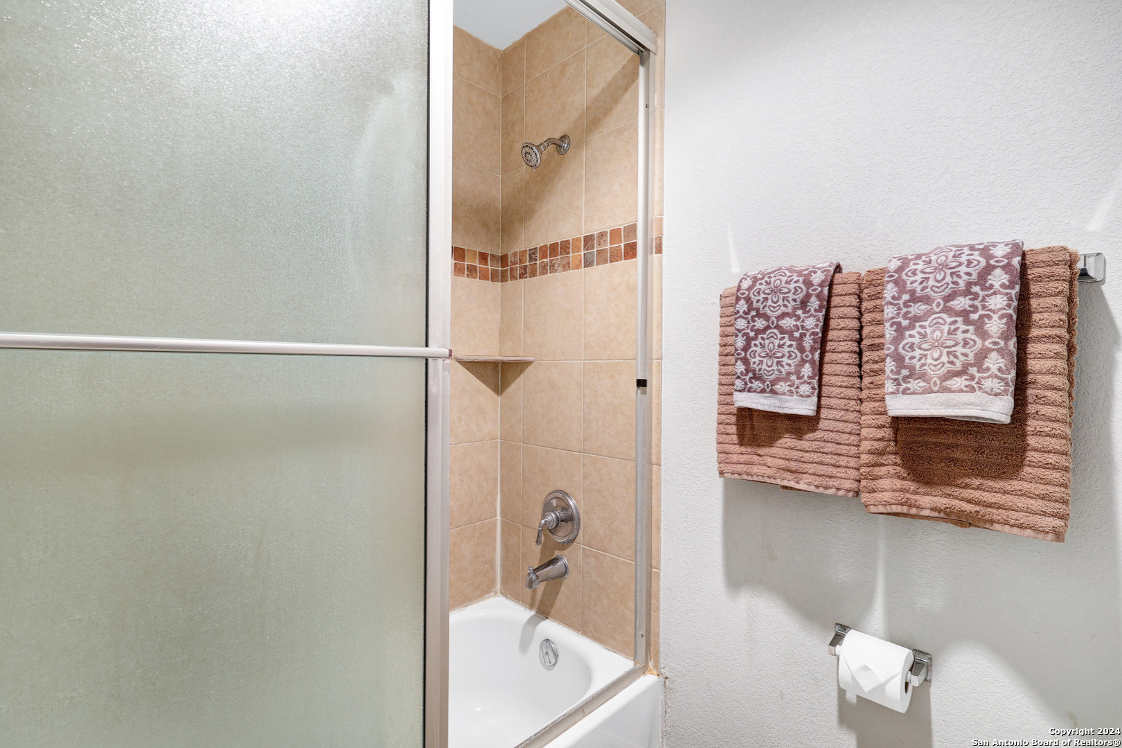 7323 Snowden Road, Unit 3308 San Antonio, TX 78229 - Photo 16 of 26 a bathroom with a shower and a sink