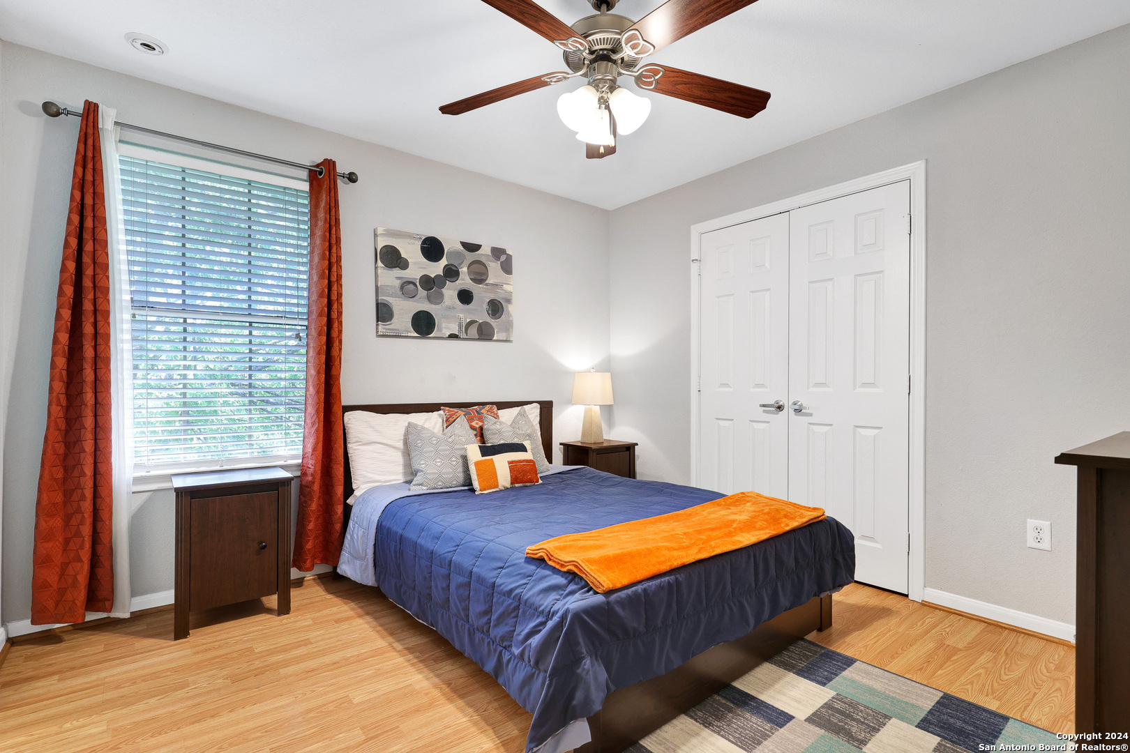 7323 Snowden Road, Unit 3308 San Antonio, TX 78229 - Photo 21 of 26 a bedroom with a bed and a chandelier