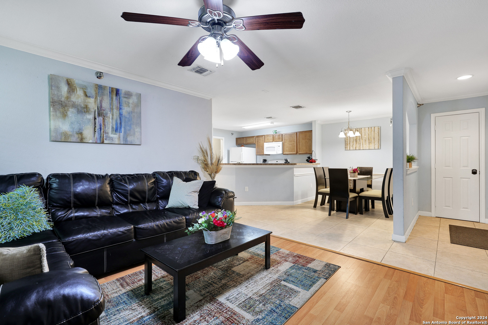 7323 Snowden Road, Unit 3308 San Antonio, TX 78229 - Photo 6 of 26 a living room with furniture and a dining table with kitchen view