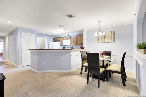 a kitchen with cabinets and window