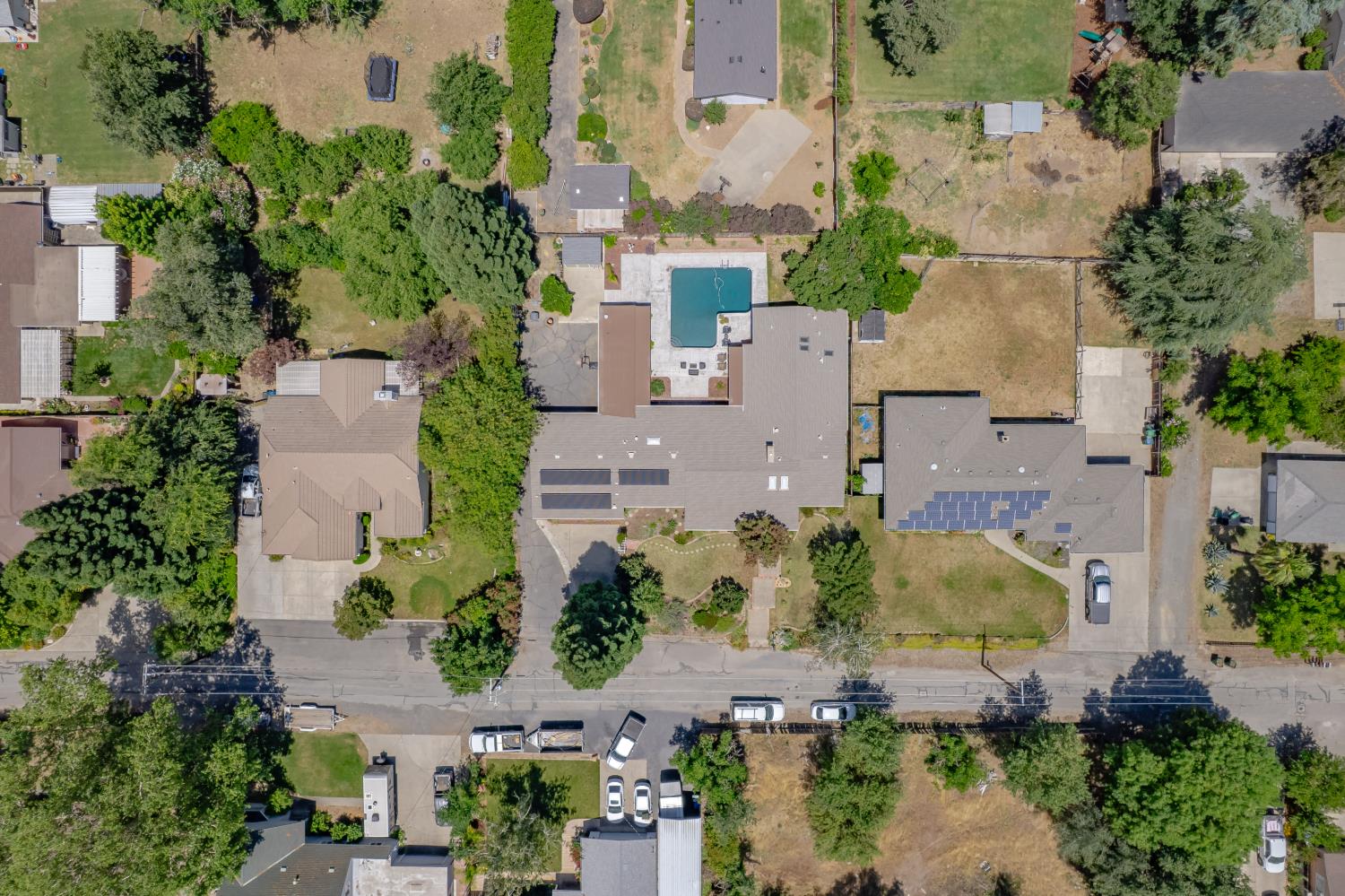 1880 Magnolia Street Gridley, CA 95948 - Photo 84 of 95 an aerial view of residential houses with outdoor space and swimming pool