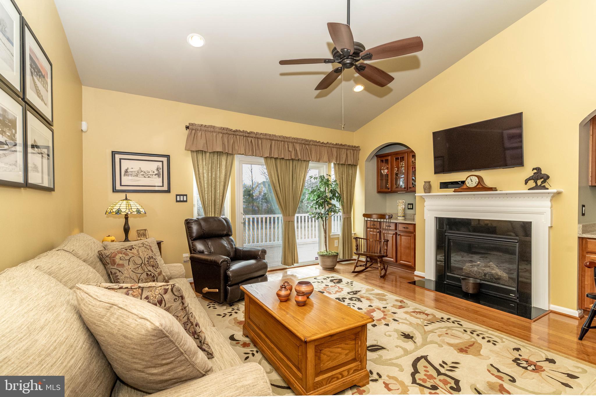 9 Alcott Way Marlton, NJ 08053 - Photo 17 of 51 a living room with furniture a flat screen tv and a fireplace