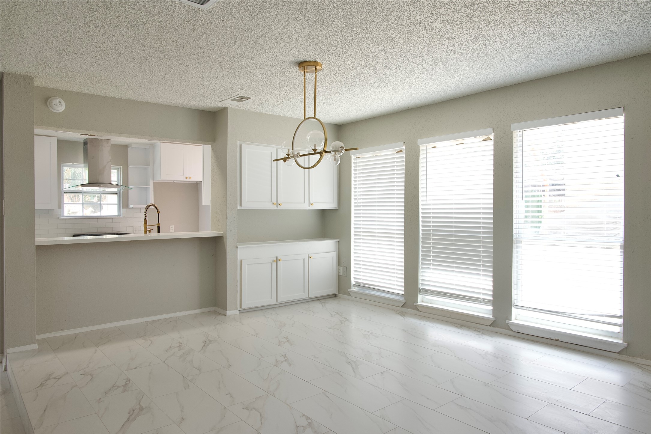 5111 Pinewilde Drive Houston, TX 77066 - Photo 11 of 37 a view of a kitchen with a sink and dishwasher cabinets