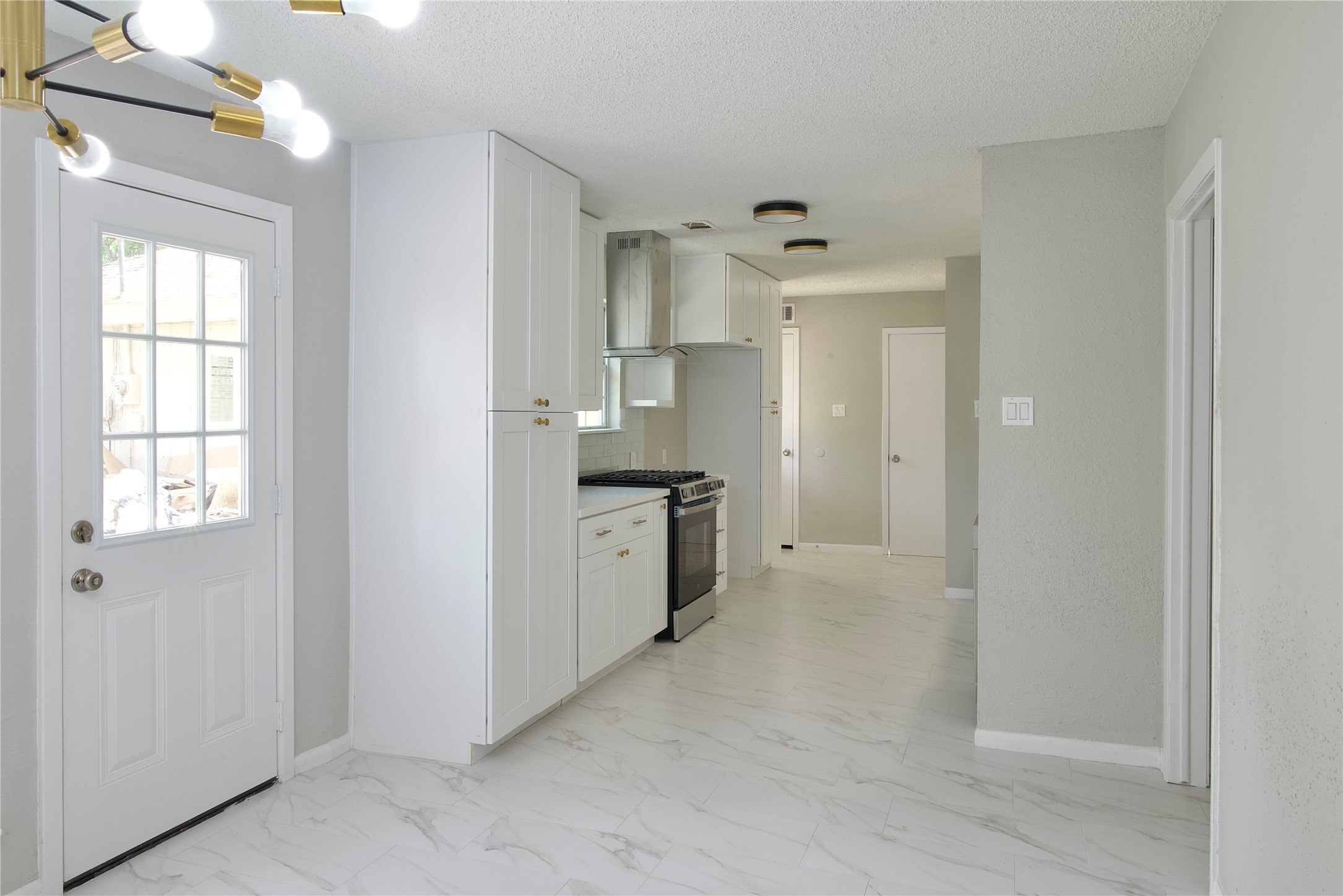 5111 Pinewilde Drive Houston, TX 77066 - Photo 17 of 37 a view of a kitchen with a sink and dishwasher a refrigerator with wooden floor
