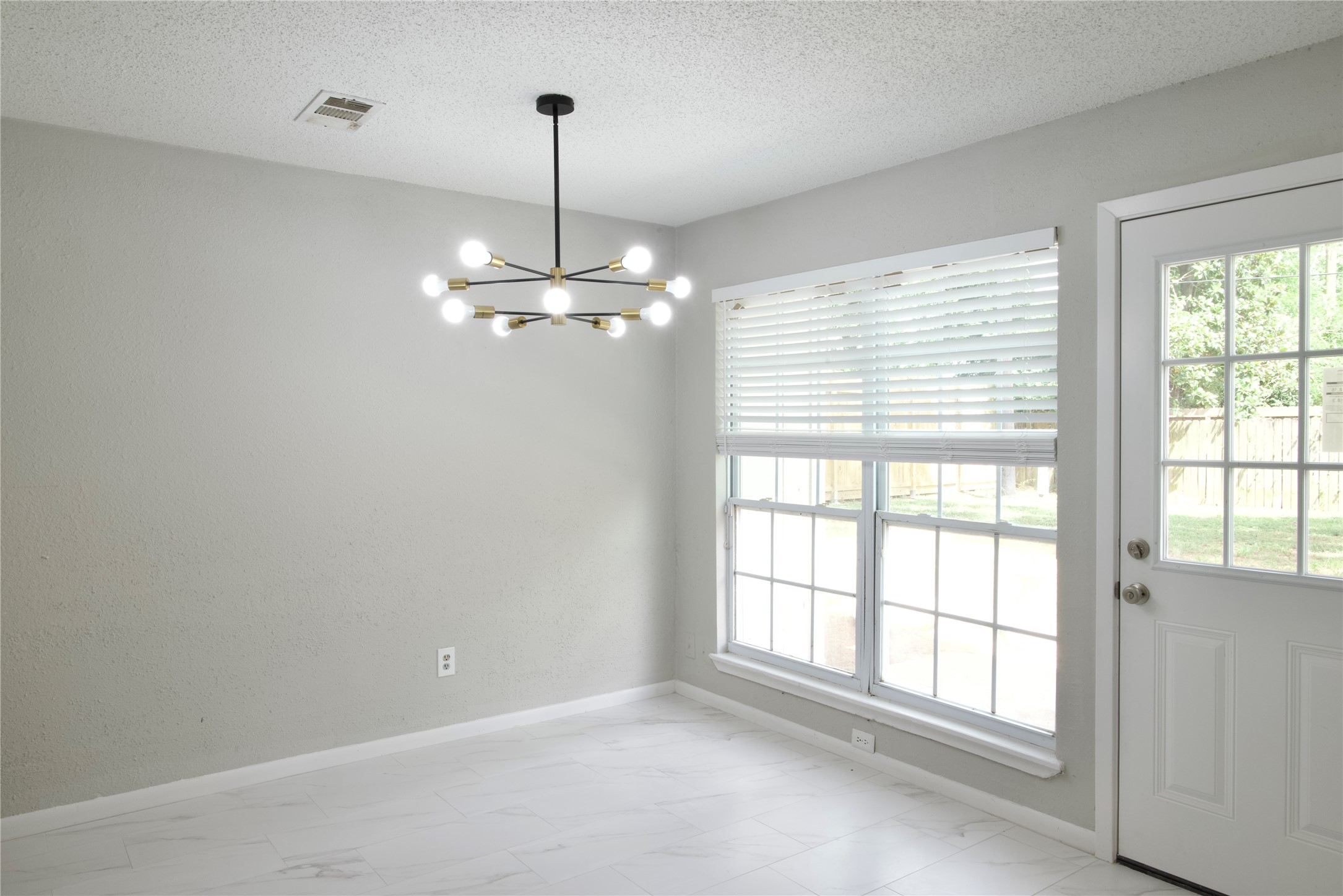 5111 Pinewilde Drive Houston, TX 77066 - Photo 20 of 37 a view of an empty room with a window