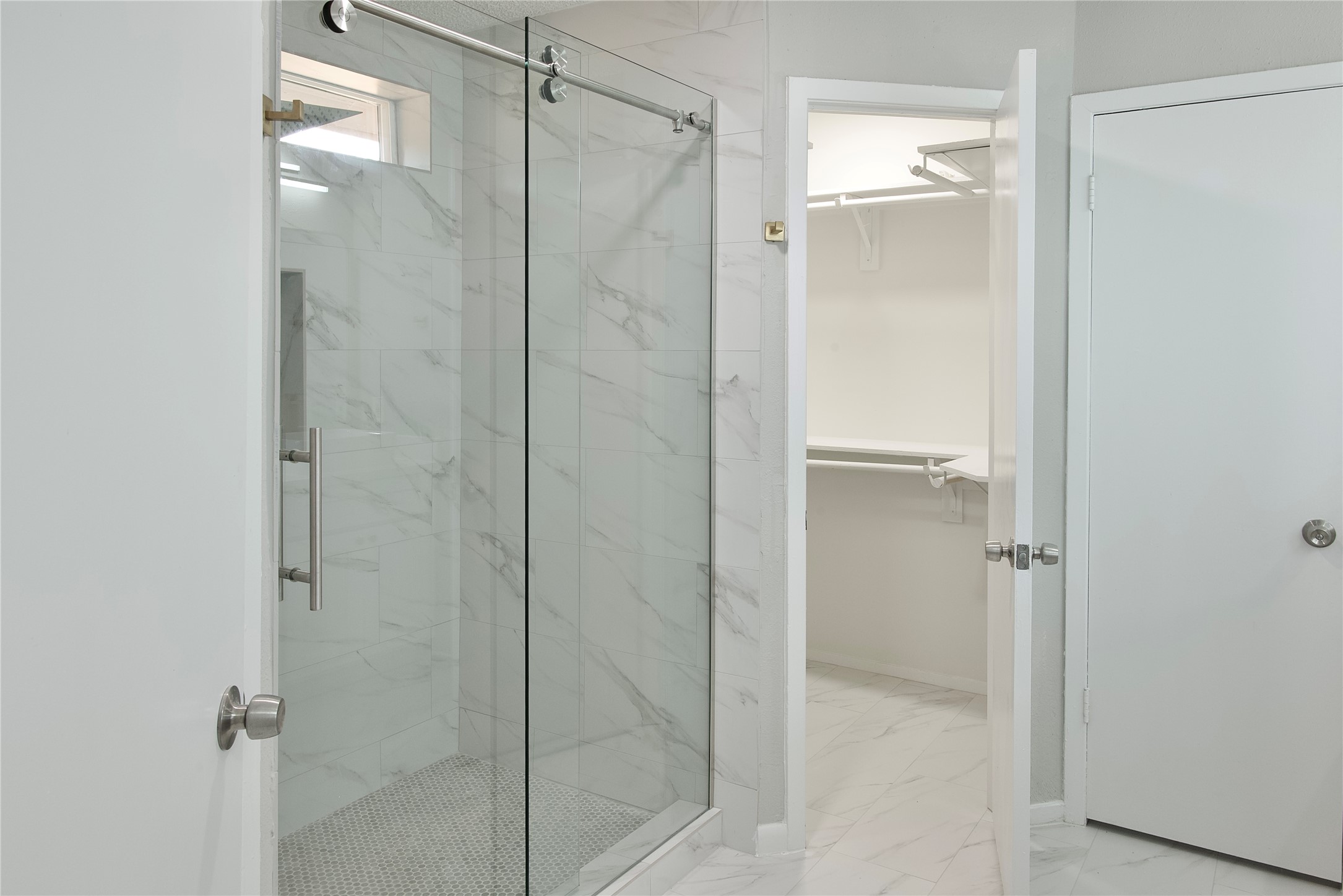 5111 Pinewilde Drive Houston, TX 77066 - Photo 24 of 37 a bathroom with a glass shower door