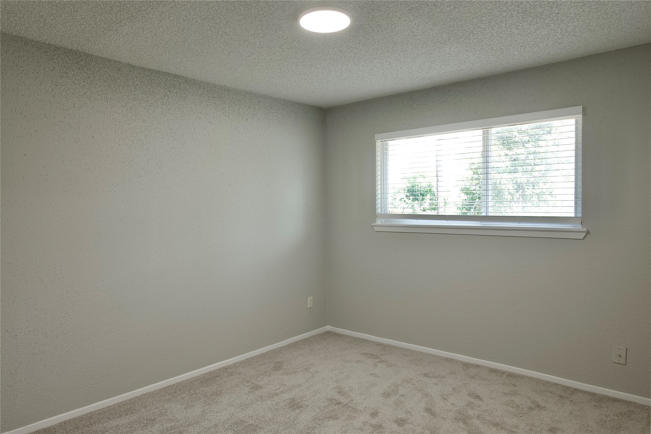 5111 Pinewilde Drive Houston, TX 77066 - Photo 29 of 37 an empty room with a window