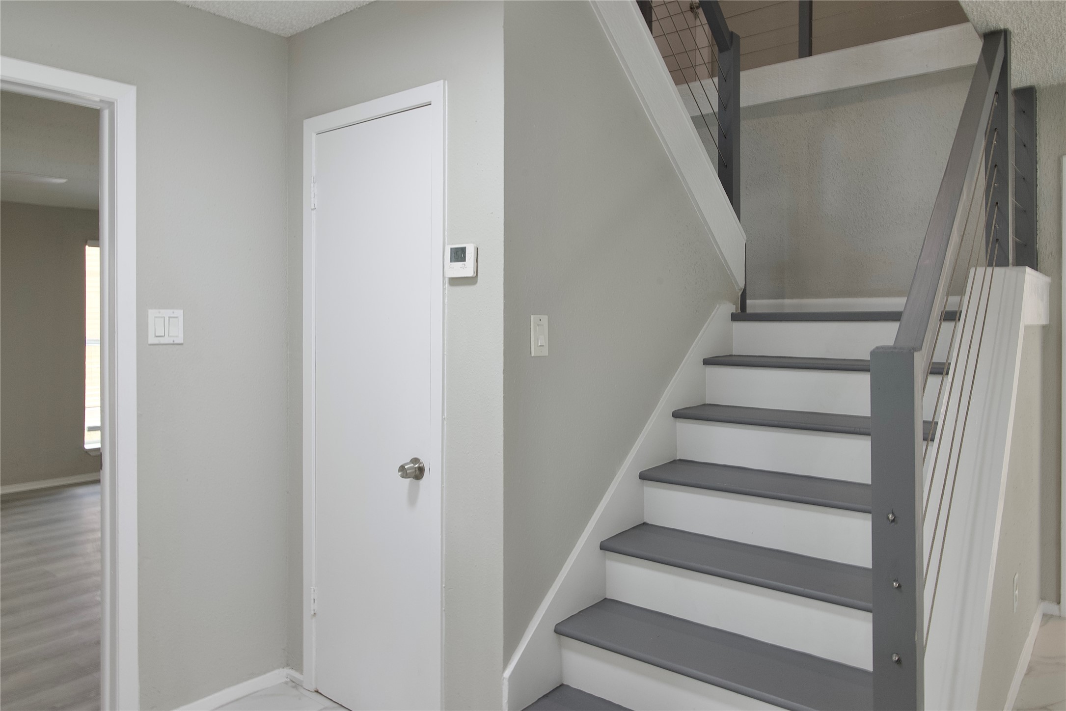 5111 Pinewilde Drive Houston, TX 77066 - Photo 6 of 37 a view of staircase with white walls and white door