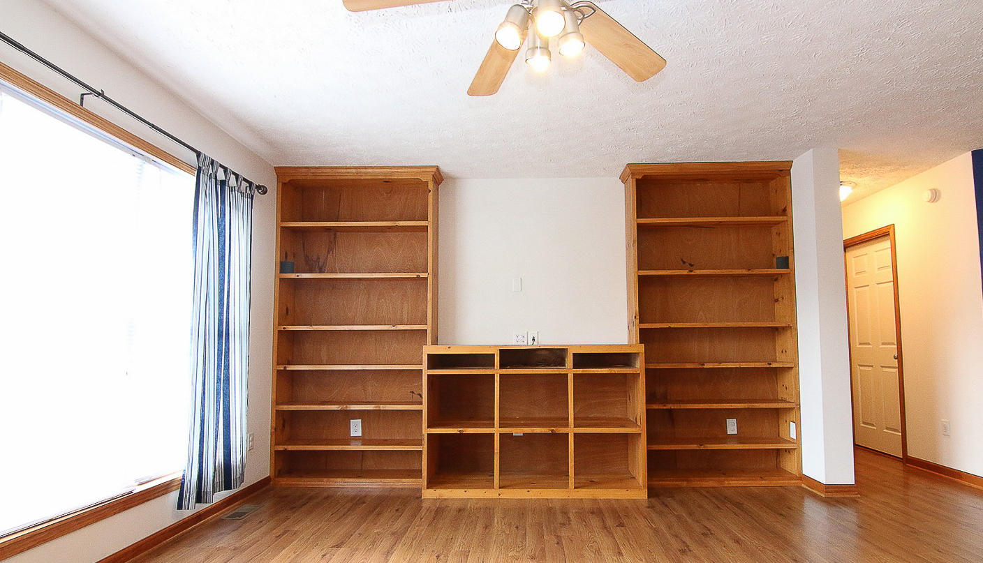 860 Beech Mountain Road Ferrum, VA 24088 - Photo 9 of 48 a view of an empty room with wooden floor and windows