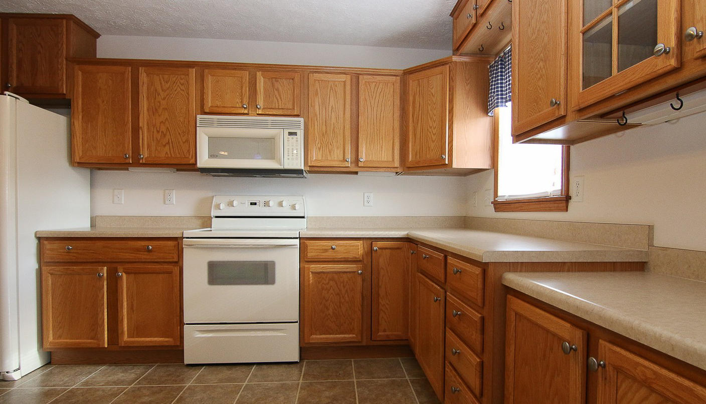 860 Beech Mountain Road Ferrum, VA 24088 - Photo 13 of 48 a kitchen with a sink stove and cabinets