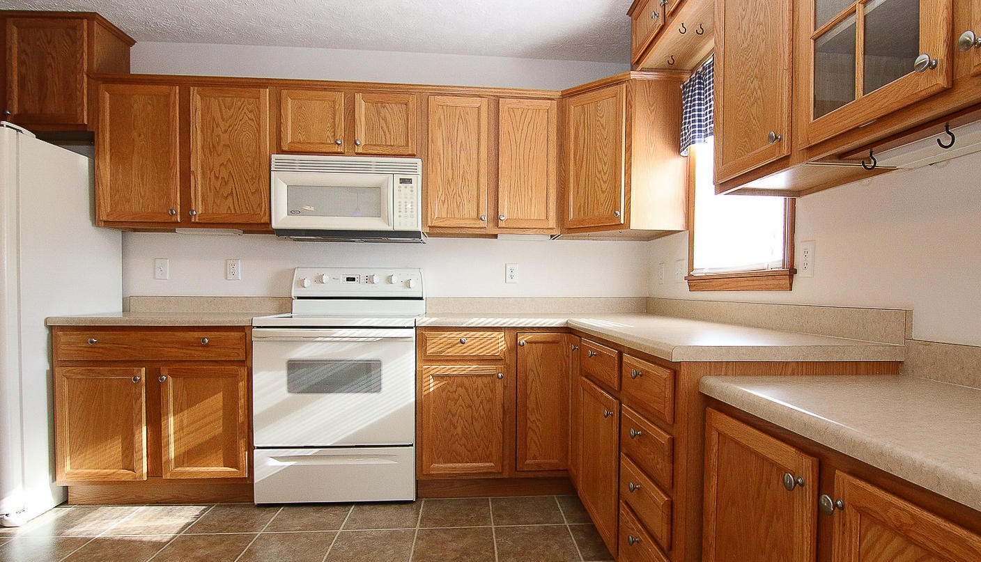 860 Beech Mountain Road Ferrum, VA 24088 - Photo 16 of 48 a kitchen with a sink stove and microwave