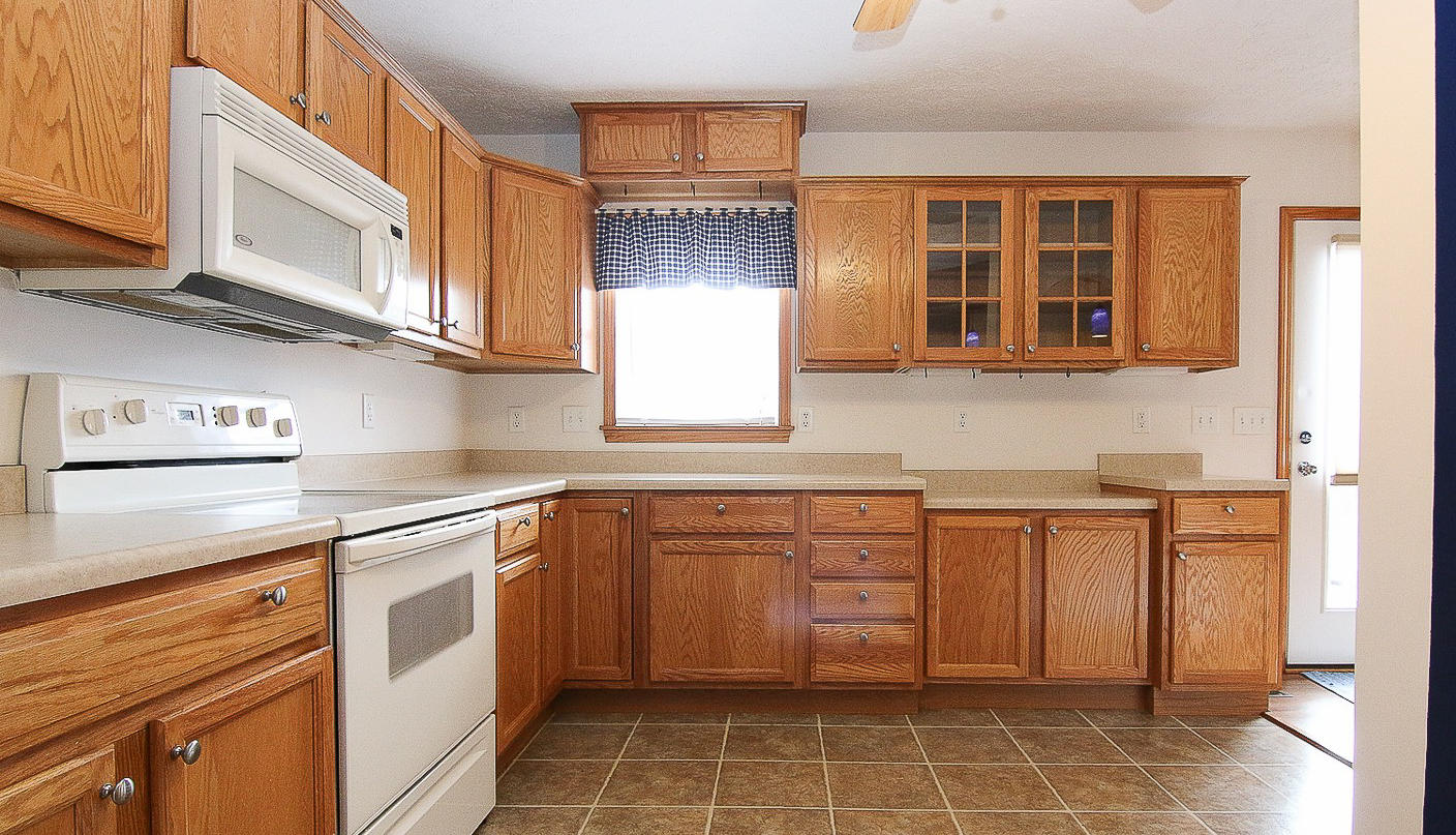 860 Beech Mountain Road Ferrum, VA 24088 - Photo 17 of 48 a kitchen with stainless steel appliances granite countertop a sink and cabinets