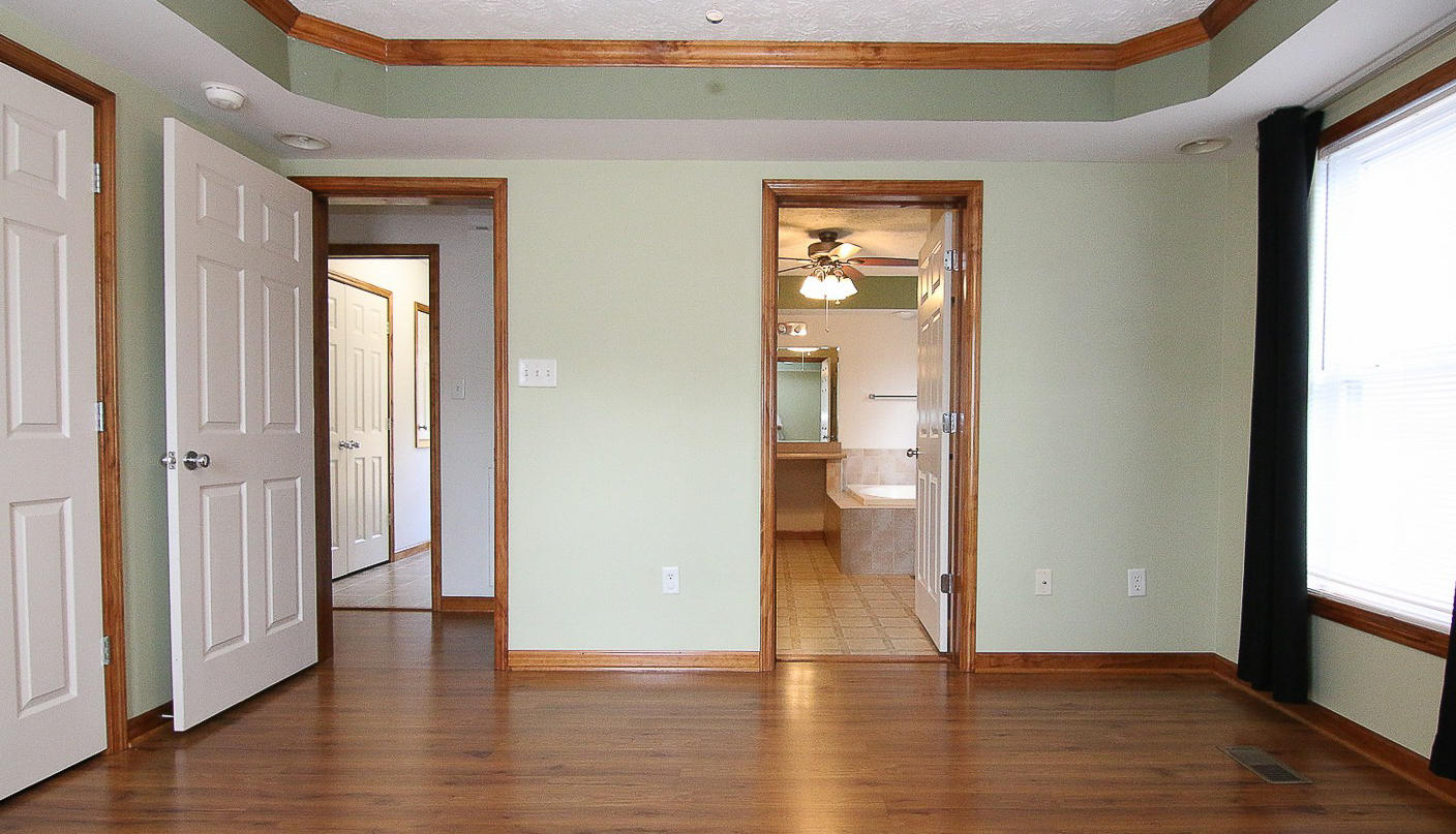 860 Beech Mountain Road Ferrum, VA 24088 - Photo 20 of 48 a view of empty room with wooden floor and fan