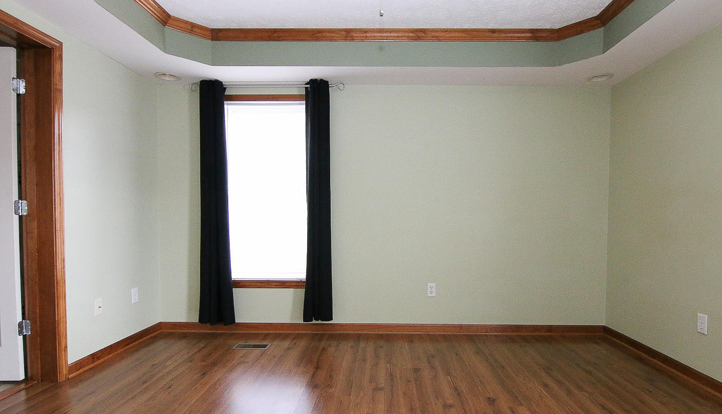 860 Beech Mountain Road Ferrum, VA 24088 - Photo 21 of 48 a view of an empty room with wooden floor and a window