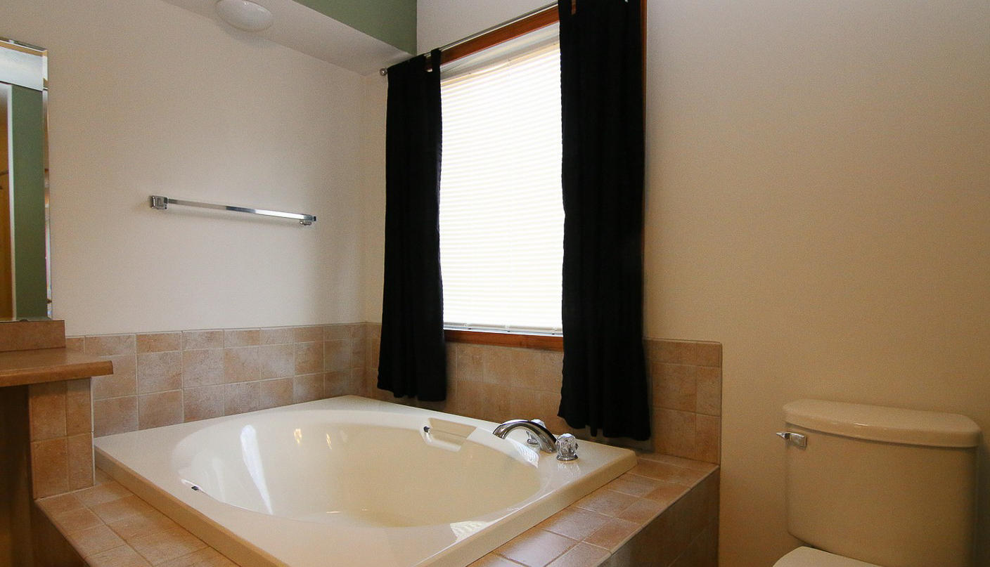 860 Beech Mountain Road Ferrum, VA 24088 - Photo 23 of 48 a bathroom with a tub and a sink