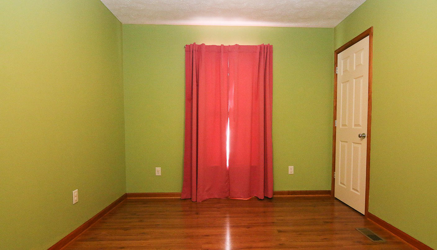 860 Beech Mountain Road Ferrum, VA 24088 - Photo 24 of 48 a view of a room with wooden floor and a window