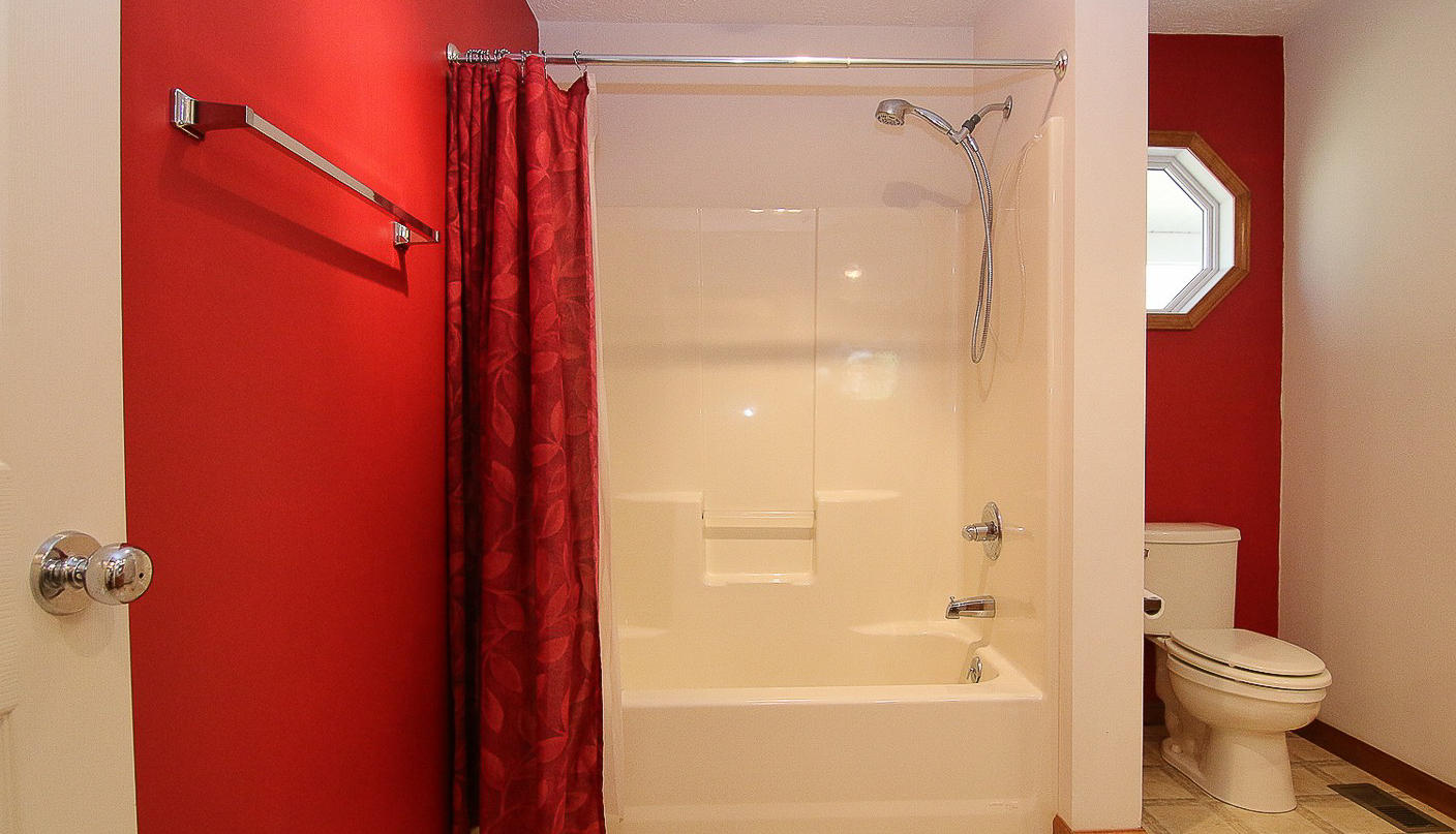 860 Beech Mountain Road Ferrum, VA 24088 - Photo 26 of 48 a bathroom with a shower and a toilet