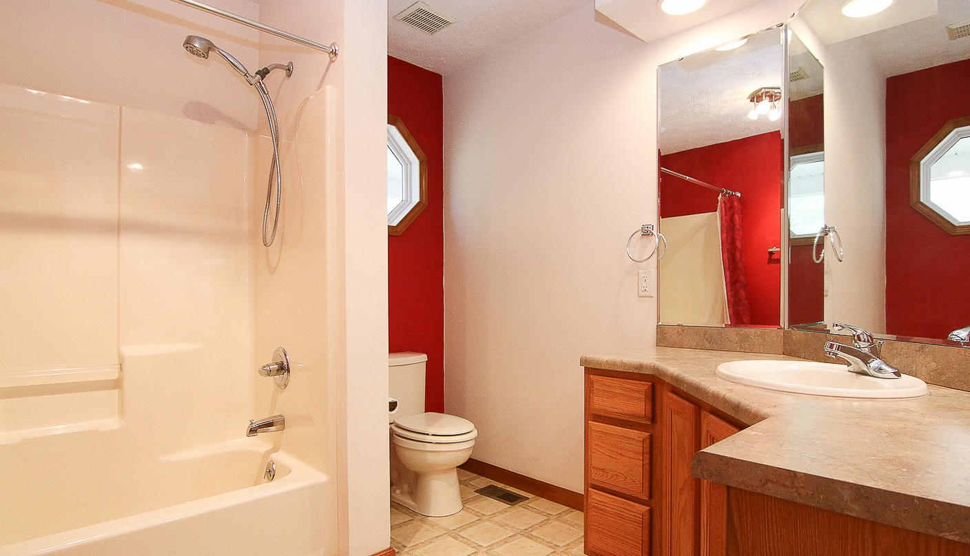 860 Beech Mountain Road Ferrum, VA 24088 - Photo 27 of 48 a bathroom with a sink and a mirror