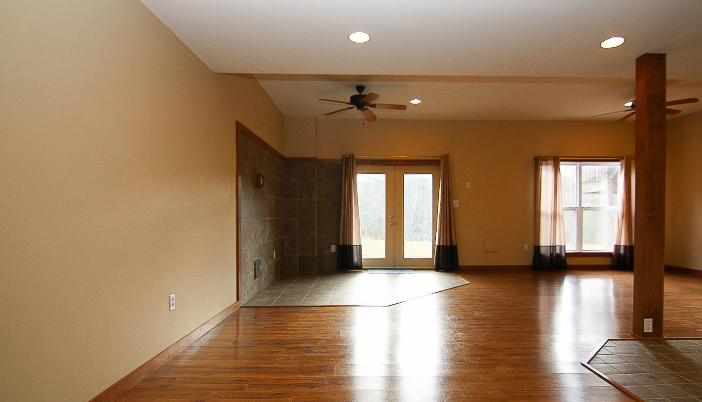 860 Beech Mountain Road Ferrum, VA 24088 - Photo 30 of 48 a view of empty room with wooden floor and fan