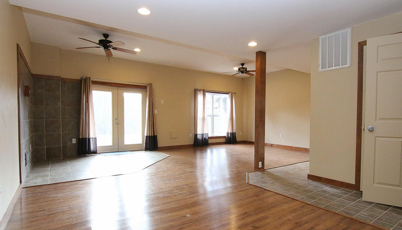 860 Beech Mountain Road Ferrum, VA 24088 - Photo 31 of 48 wooden floor in an empty room with a window
