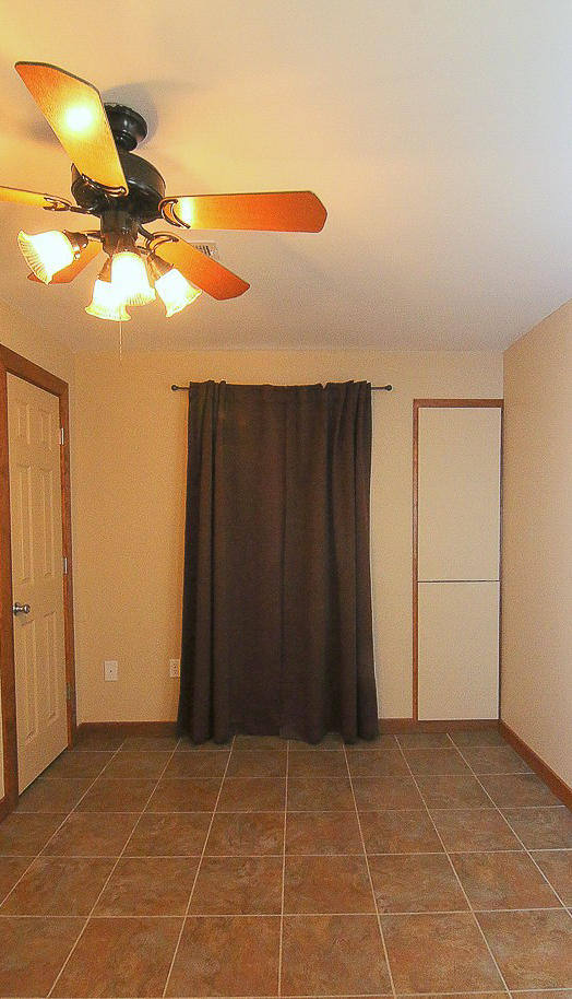 860 Beech Mountain Road Ferrum, VA 24088 - Photo 34 of 48 a view of a room with a ceiling fan and carpet
