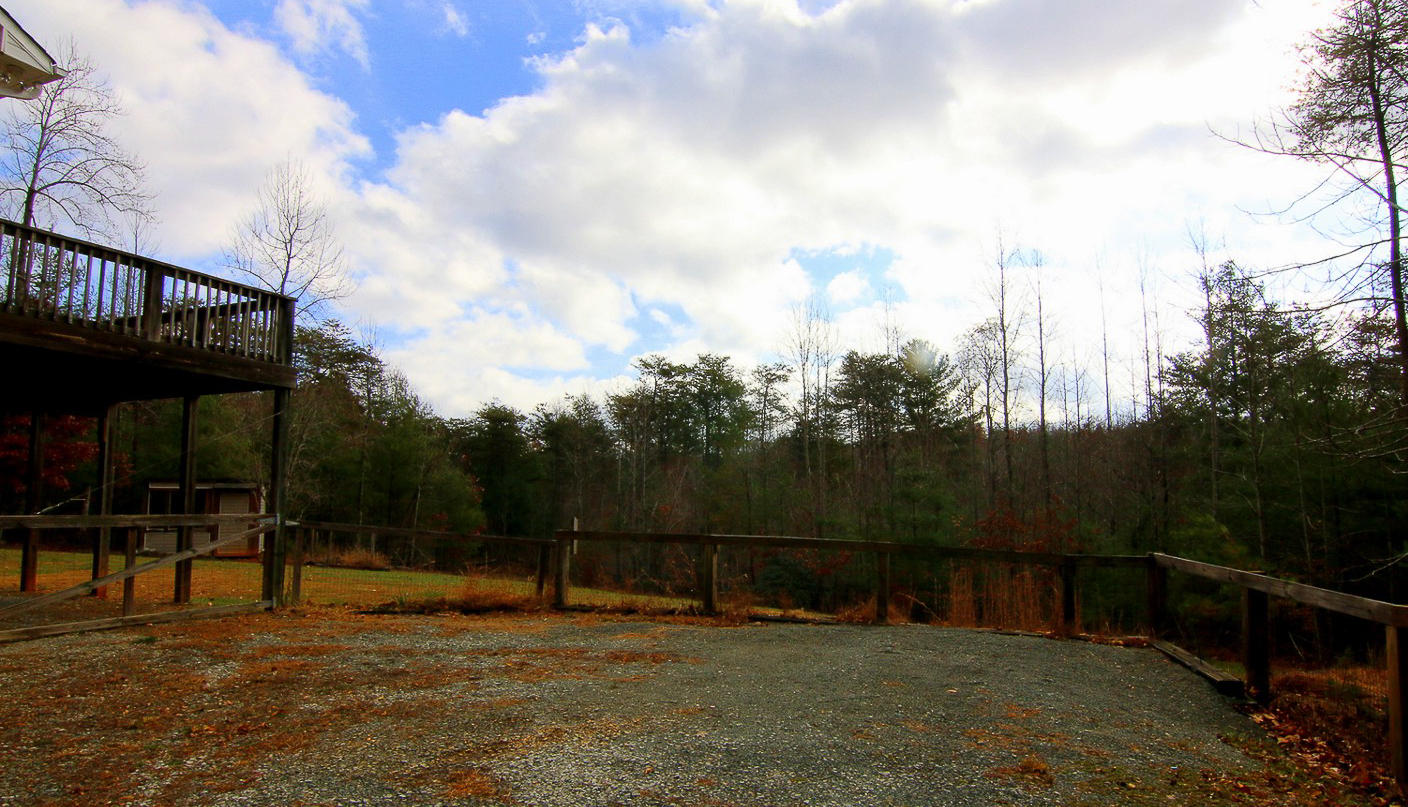 860 Beech Mountain Road Ferrum, VA 24088 - Photo 43 of 48 a backyard of a house with table and chairs