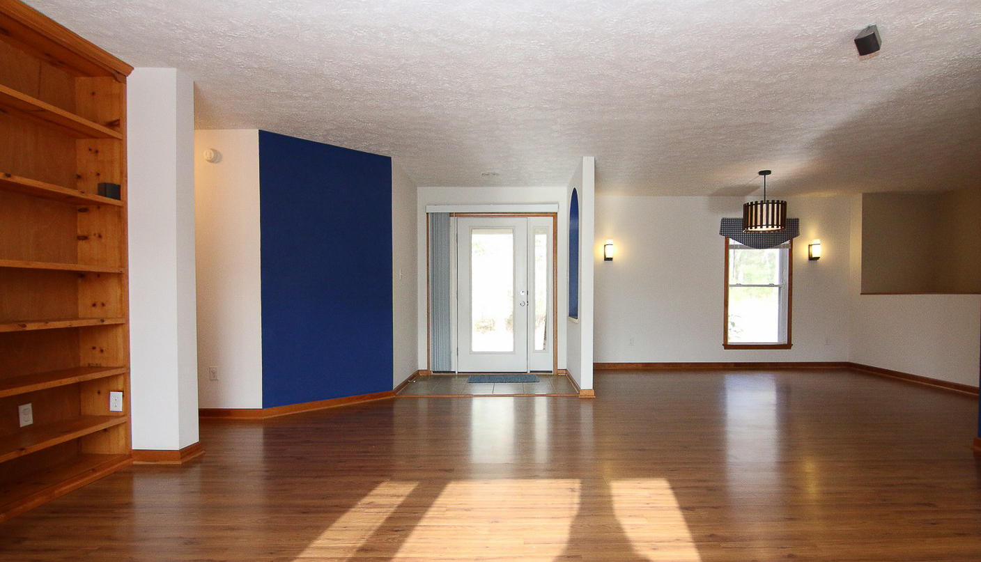 860 Beech Mountain Road Ferrum, VA 24088 - Photo 6 of 48 a view of an empty room with window and wooden floor