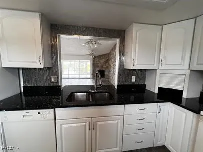 a bathroom with a sink and granite