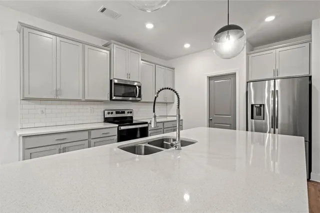 a bathroom with a bathtub and a sink
