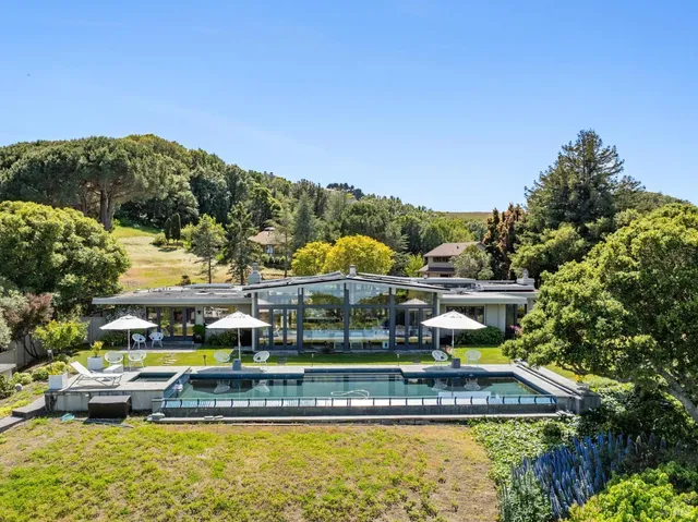 a view of swimming pool with outdoor seating and yard