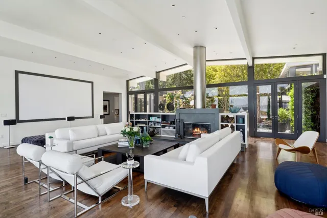 a view of a swimming pool with an outdoor seating space