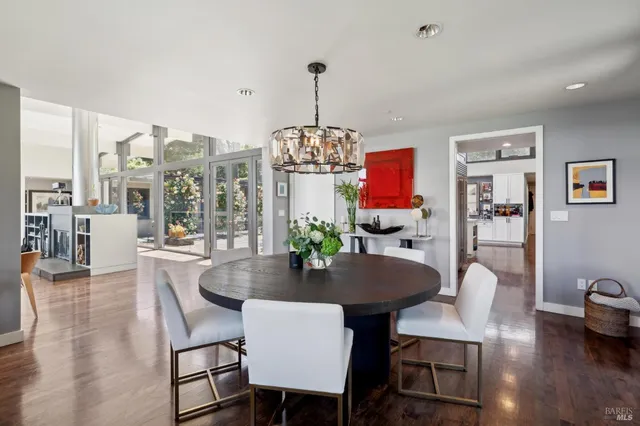 a kitchen with a stove a sink and wooden cabinets