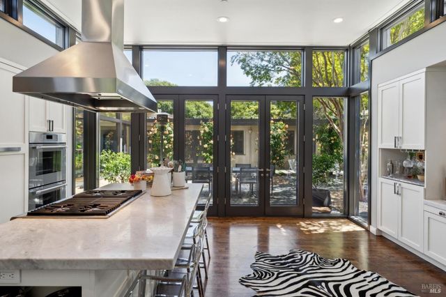 a kitchen with a sink stove and wooden cabinets