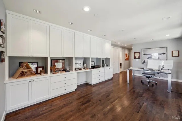 a bedroom with a large bed and a large window