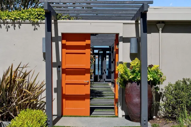 a view of path with potted plants