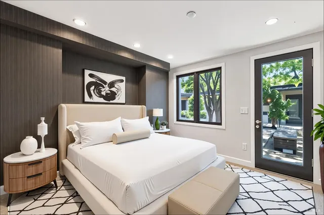 a bedroom with a bed and window